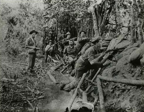 Black and white photograph of Minnesota soldiers on guard around Manila.